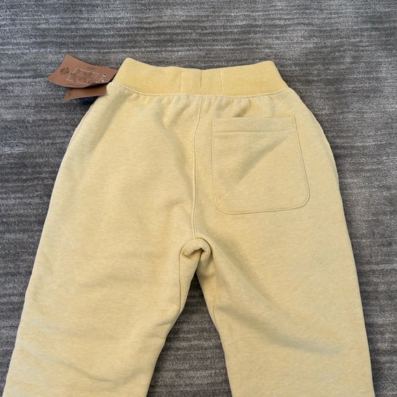 Champion reverse weave men’s slim jogger fleece pant in pale yellow size XS - Picture 3 of 6